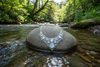 necklace on roack in the middle of river